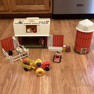 Fisher-Price Vintage Family Farm Play-set with Red Barn and Yellow Tractor.